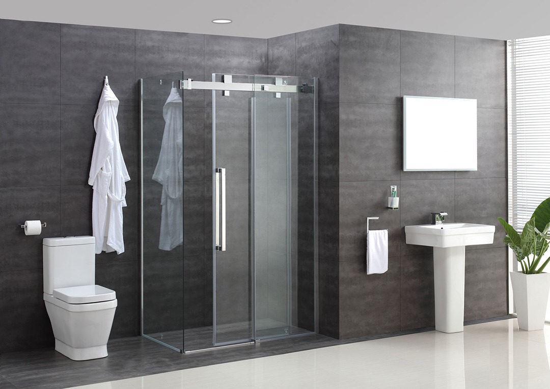 Modern style white floor and black wall tiles. Clear all glass shower with sleek silver handle.