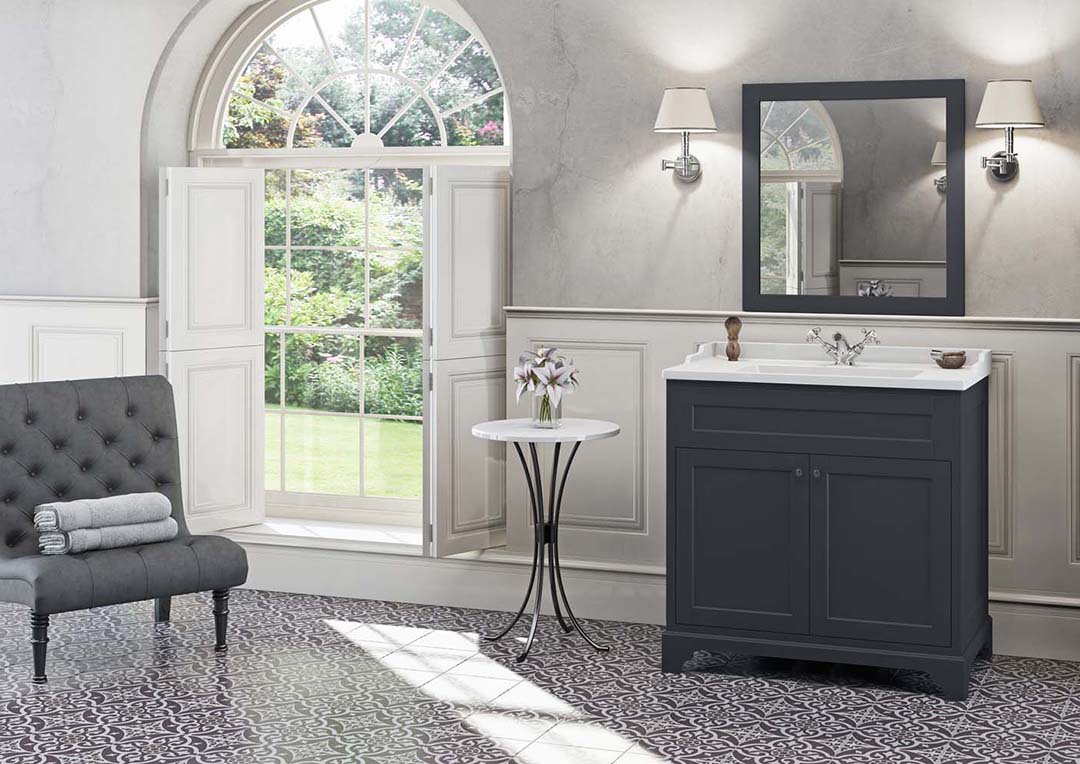 bright room. Dark cabinets with white worktop.