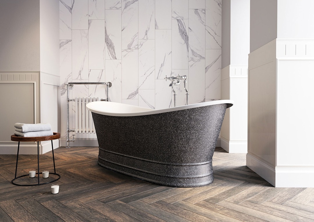 Deep rock texture bath. Dark exterior and white interior. Dark parquet flooring and marvel effect walls.