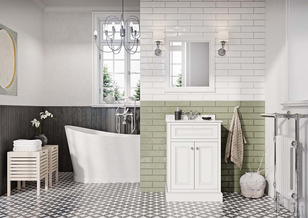 Small white tiles, black grouting. White cabinet. Green tiles half way up the wall and white at the top. Behind the wall is a white high backed bath.