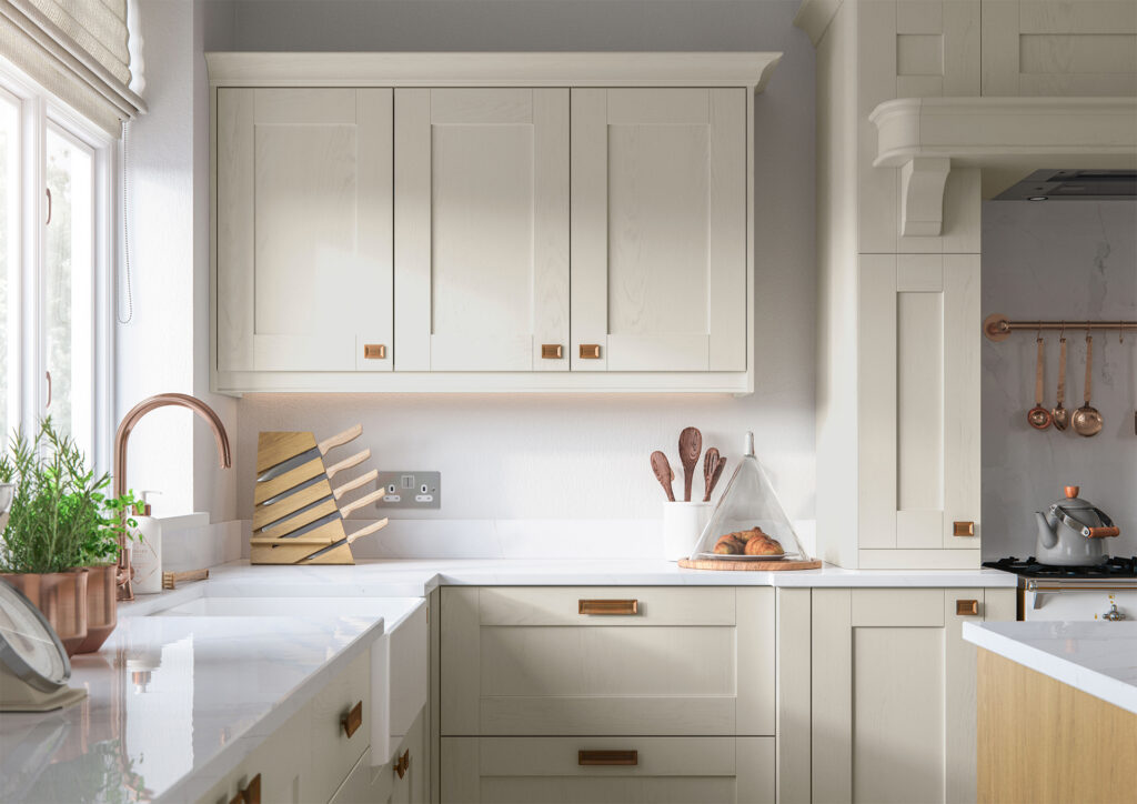 Mussel white shaker kitchen with white marble worktop.